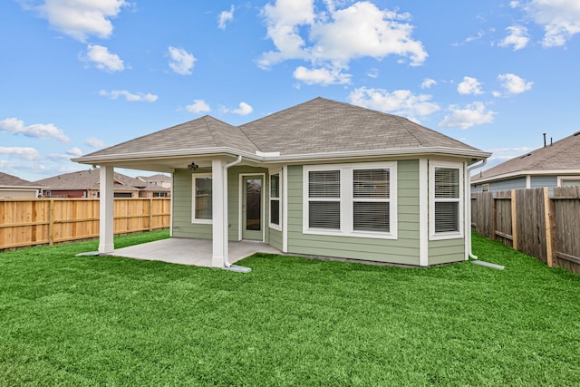 back of house with a lawn, a patio, and ceiling fan