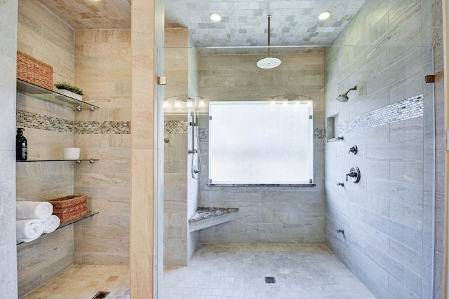 bathroom with tiled shower