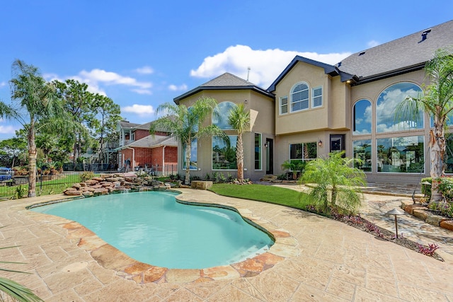 view of swimming pool with a patio