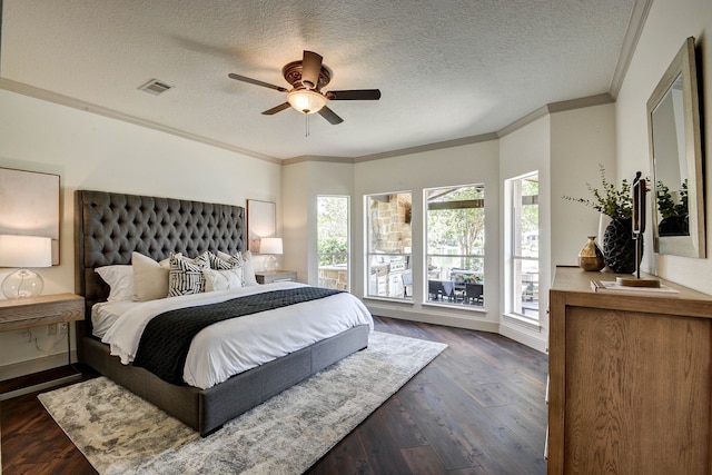 bedroom featuring ceiling fan, dark hardwood / wood-style floors, ornamental molding, and a textured ceiling