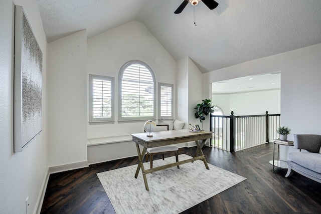 office area featuring dark wood-type flooring, ceiling fan, and vaulted ceiling