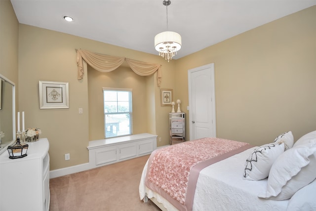 carpeted bedroom with a notable chandelier