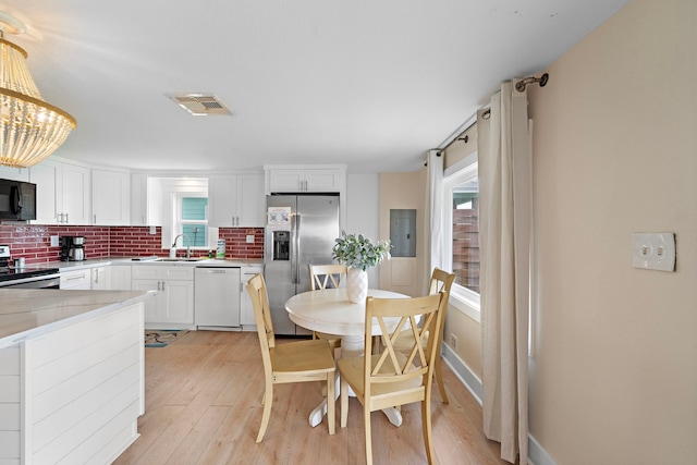 417 Olive St, Surfside Beach, TX 77541 - kitchen featuring a healthy amount of sunlight, stainless steel appliances, visible vents, and a sink