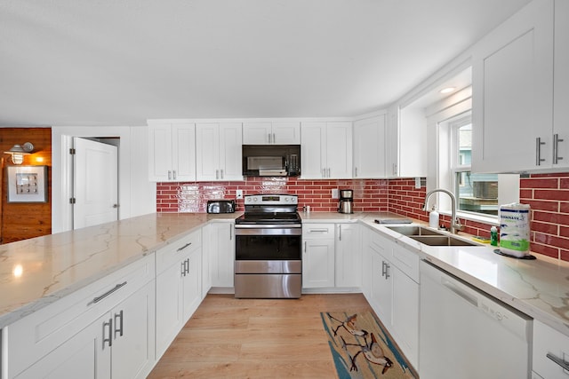 kitchen with stainless steel electric range, dishwasher, light wood-type flooring, white cabinetry, and sink