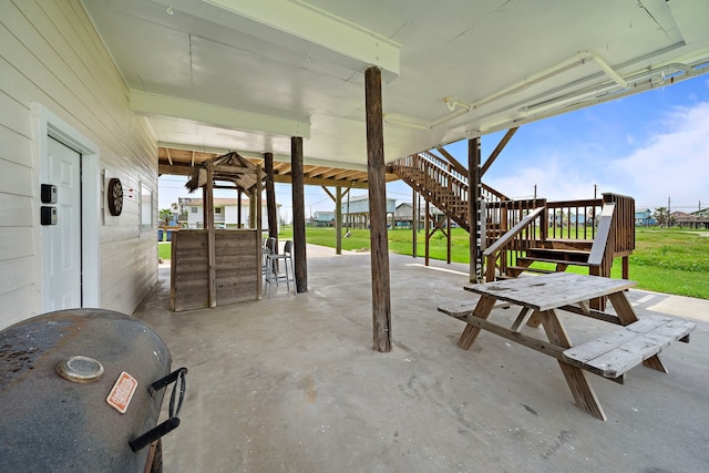 417 Olive St, Surfside Beach, TX 77541 - view of patio / terrace with outdoor dry bar and stairs
