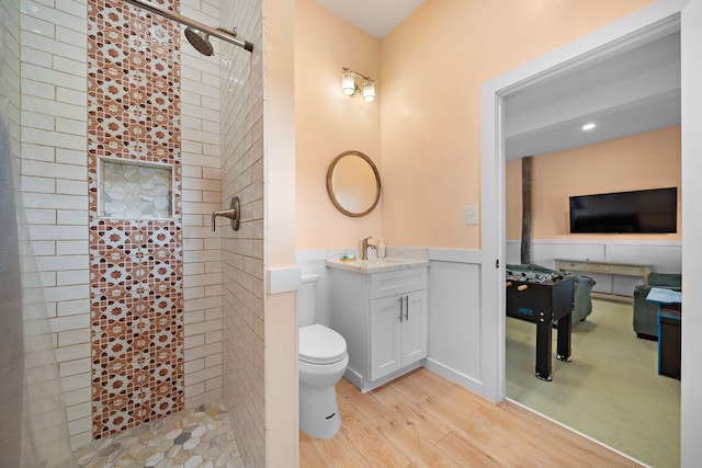 417 Olive St, Surfside Beach, TX 77541 - full bath featuring vanity, toilet, a shower stall, and wood finished floors