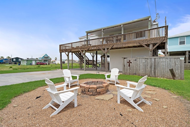 417 Olive St, Surfside Beach, TX 77541 - exterior space featuring a fire pit, a deck, and stairs
