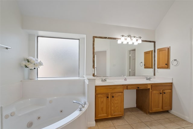 bathroom featuring tile patterned floors, vanity, and a tub