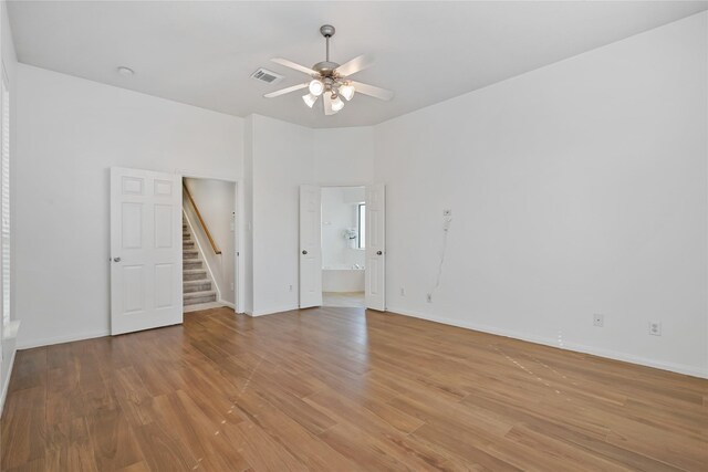 unfurnished room featuring ceiling fan and light hardwood / wood-style floors