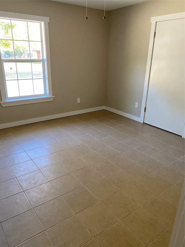 view of tiled spare room