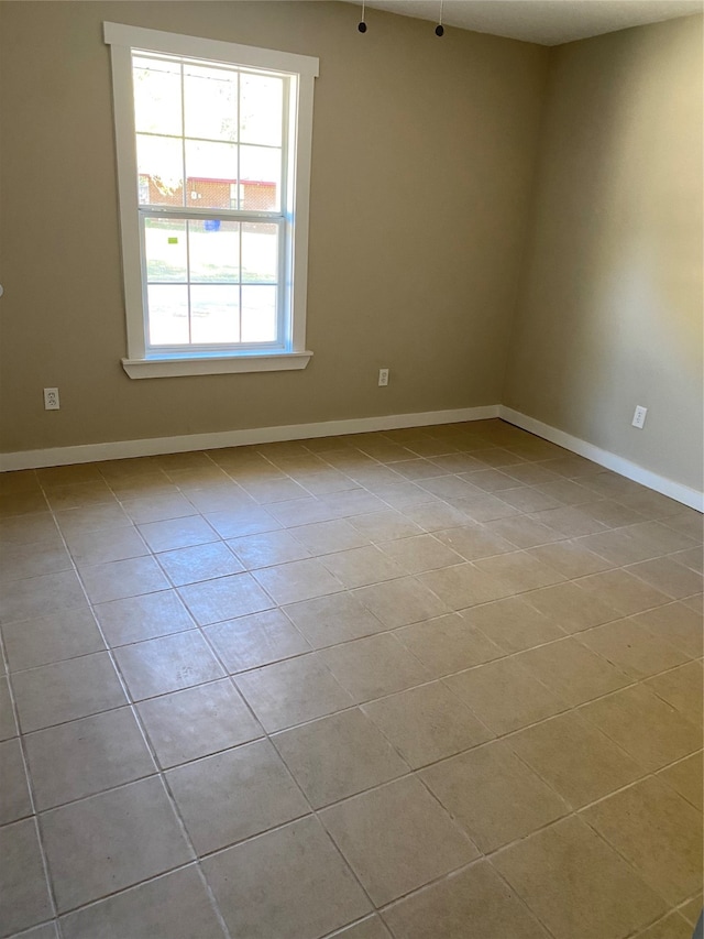 empty room featuring light tile patterned floors