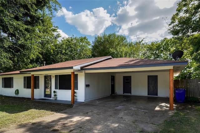 ranch-style house with a carport