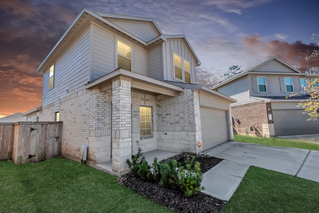 view of front facade featuring a yard and a garage