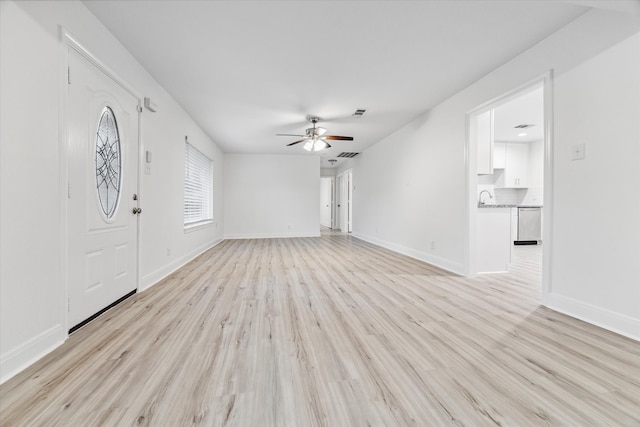 interior space featuring ceiling fan and light wood-type flooring