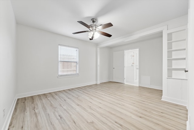 empty room featuring light wood-type flooring and ceiling fan