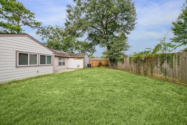 view of yard featuring central AC