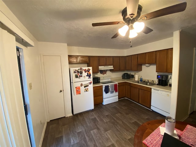 kitchen with a textured ceiling, white appliances, sink, ceiling fan, and dark hardwood / wood-style floors