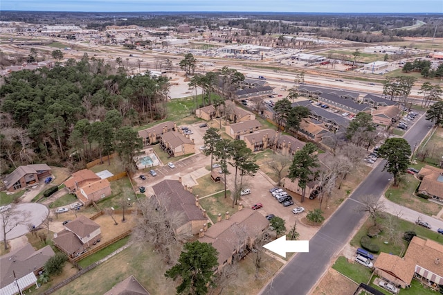 birds eye view of property with a residential view