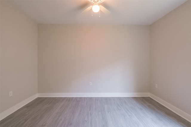 empty room featuring ceiling fan and light hardwood / wood-style floors