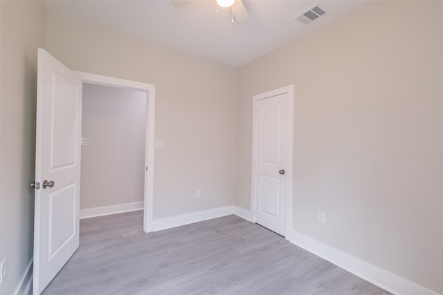 unfurnished room featuring ceiling fan and light hardwood / wood-style floors