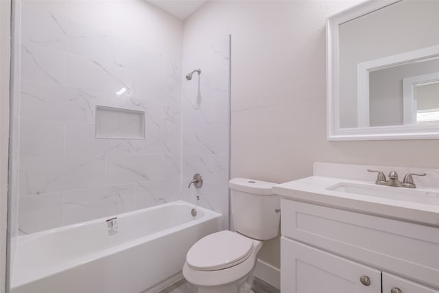 full bathroom featuring toilet, tiled shower / bath combo, and vanity