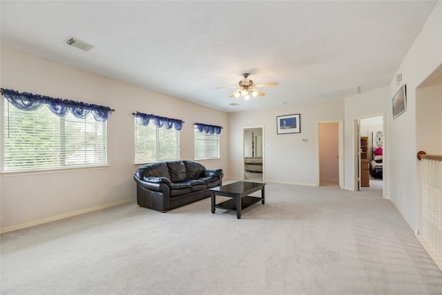 carpeted living room featuring a healthy amount of sunlight and ceiling fan