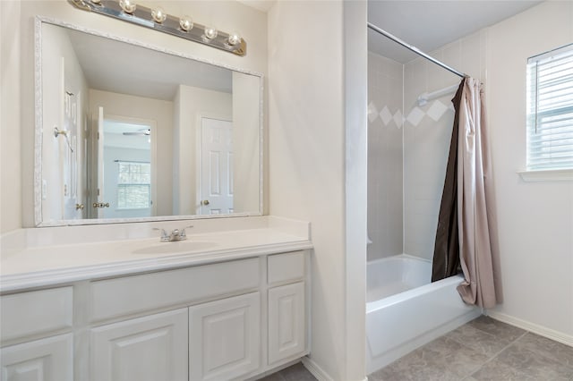 bathroom featuring vanity, shower / bath combination with curtain, and tile patterned flooring