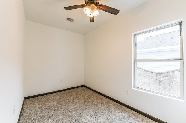 unfurnished room with carpet and ceiling fan