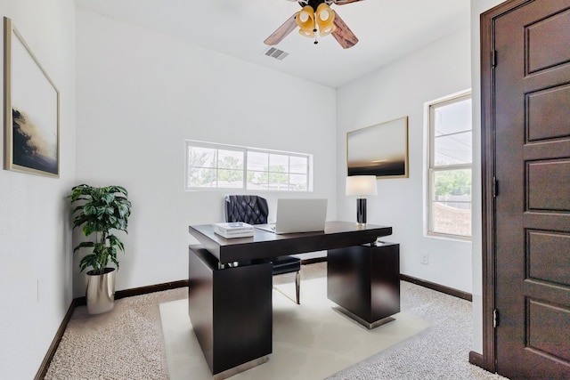 office with ceiling fan and light carpet