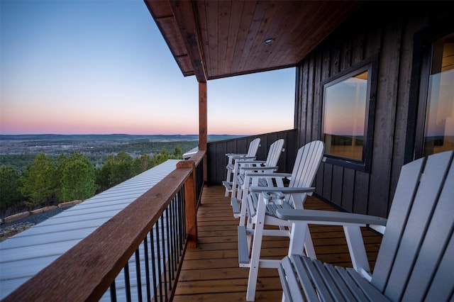 view of balcony at dusk