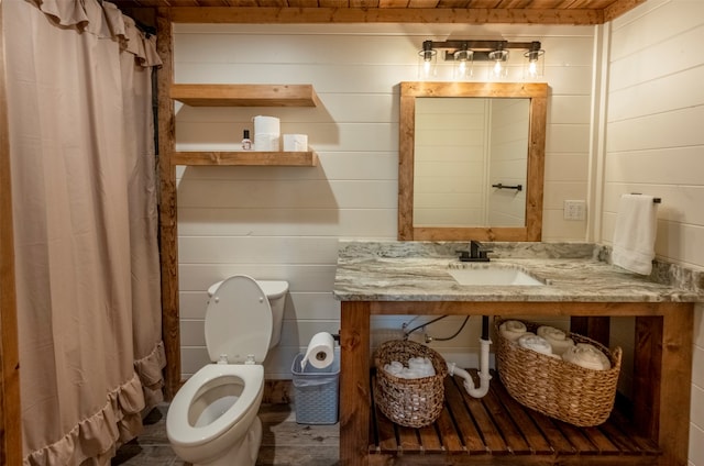 bathroom featuring curtained shower, wood ceiling, toilet, and wooden walls