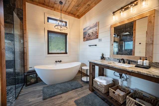 bathroom featuring wood walls, wood ceiling, sink, hardwood / wood-style flooring, and plus walk in shower