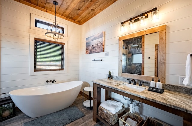 bathroom featuring a tub to relax in, hardwood / wood-style flooring, wood walls, and wooden ceiling