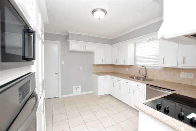 kitchen with appliances with stainless steel finishes, ornamental molding, sink, decorative backsplash, and white cabinetry