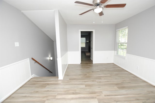 spare room featuring ceiling fan and light hardwood / wood-style flooring