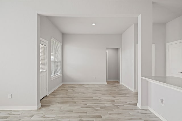 spare room featuring light hardwood / wood-style floors