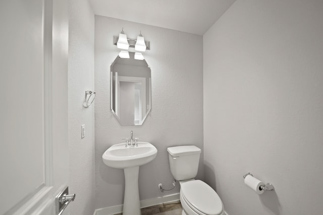 bathroom with sink and toilet