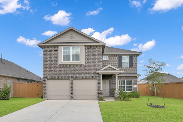 view of front property featuring a front yard and a garage