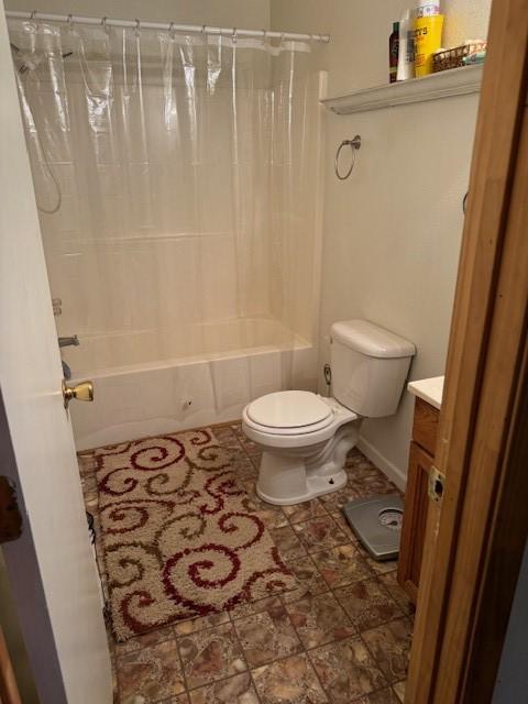 full bathroom with vanity, toilet, and shower / tub combo with curtain