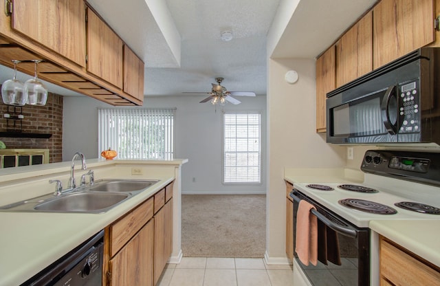 kitchen with light carpet, sink, black appliances, ceiling fan, and a textured ceiling