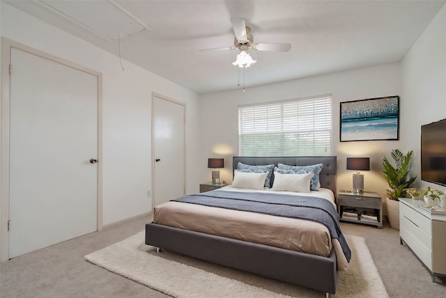 carpeted bedroom featuring ceiling fan