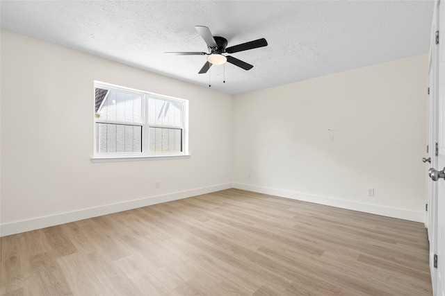 empty room featuring a textured ceiling, ceiling fan, and light hardwood / wood-style floors