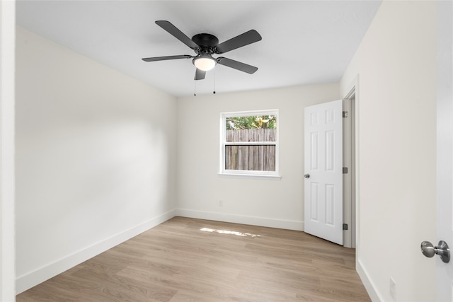 spare room featuring ceiling fan and light hardwood / wood-style floors