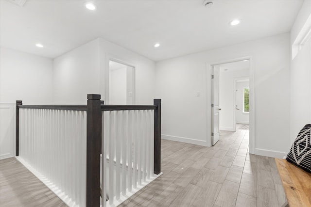 hall with light hardwood / wood-style floors