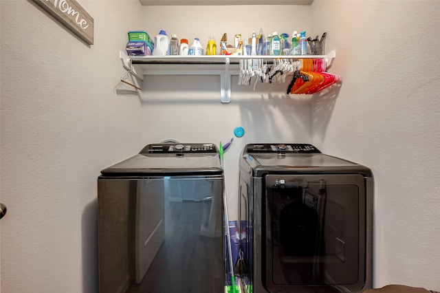 laundry area with independent washer and dryer