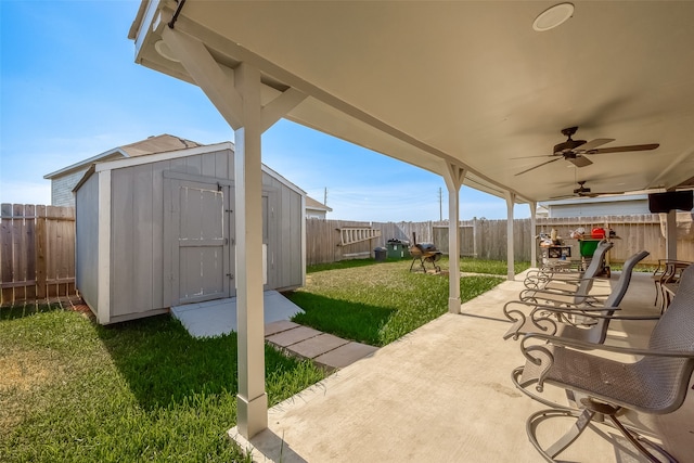 view of patio / terrace featuring ceiling fan and a storage shed