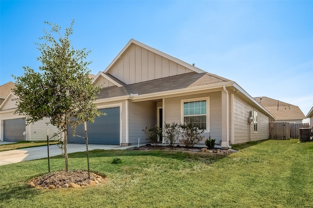 view of front facade featuring a garage, central AC unit, and a front lawn