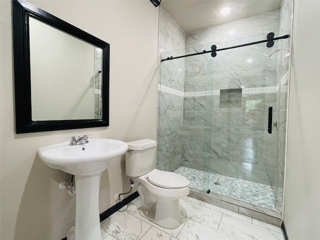 bathroom featuring sink, toilet, and walk in shower