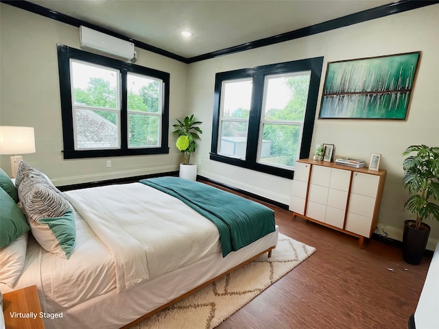 bedroom featuring a wall unit AC, multiple windows, dark wood-type flooring, and crown molding