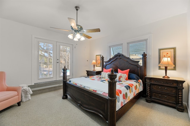 carpeted bedroom with multiple windows, ceiling fan, and access to outside